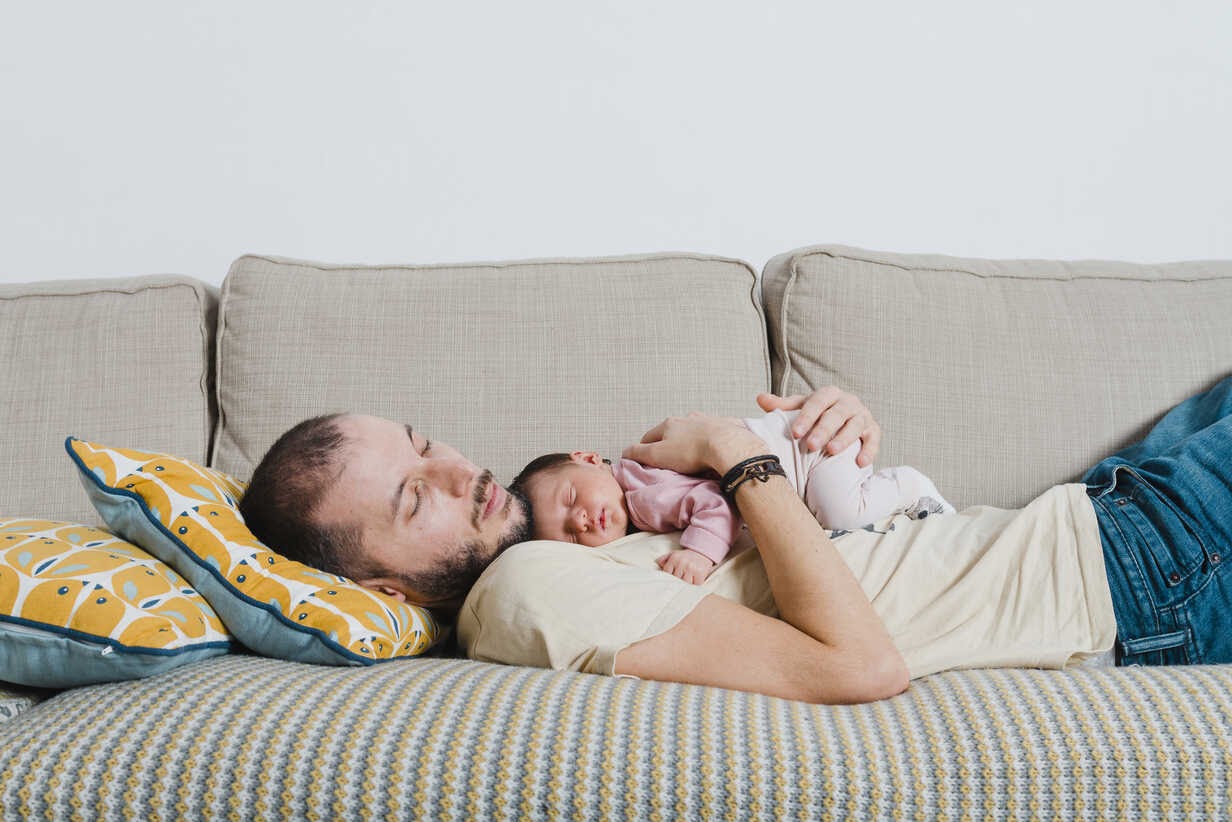 father and child napping