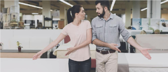 couple deciding for mattress